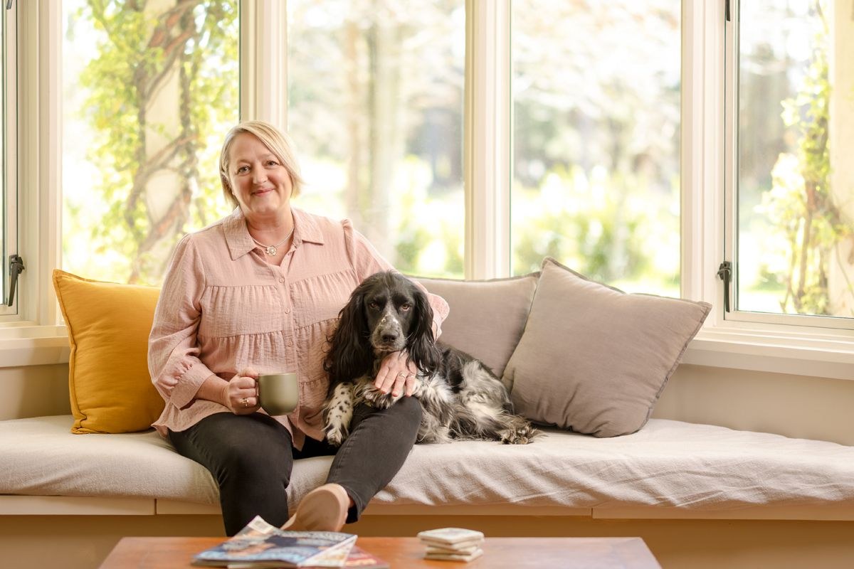 Karen Dugdale at home with her dog